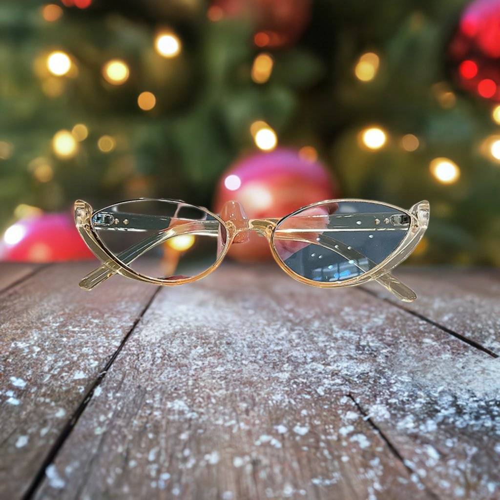 a pair of glasses sitting on top of a wooden table