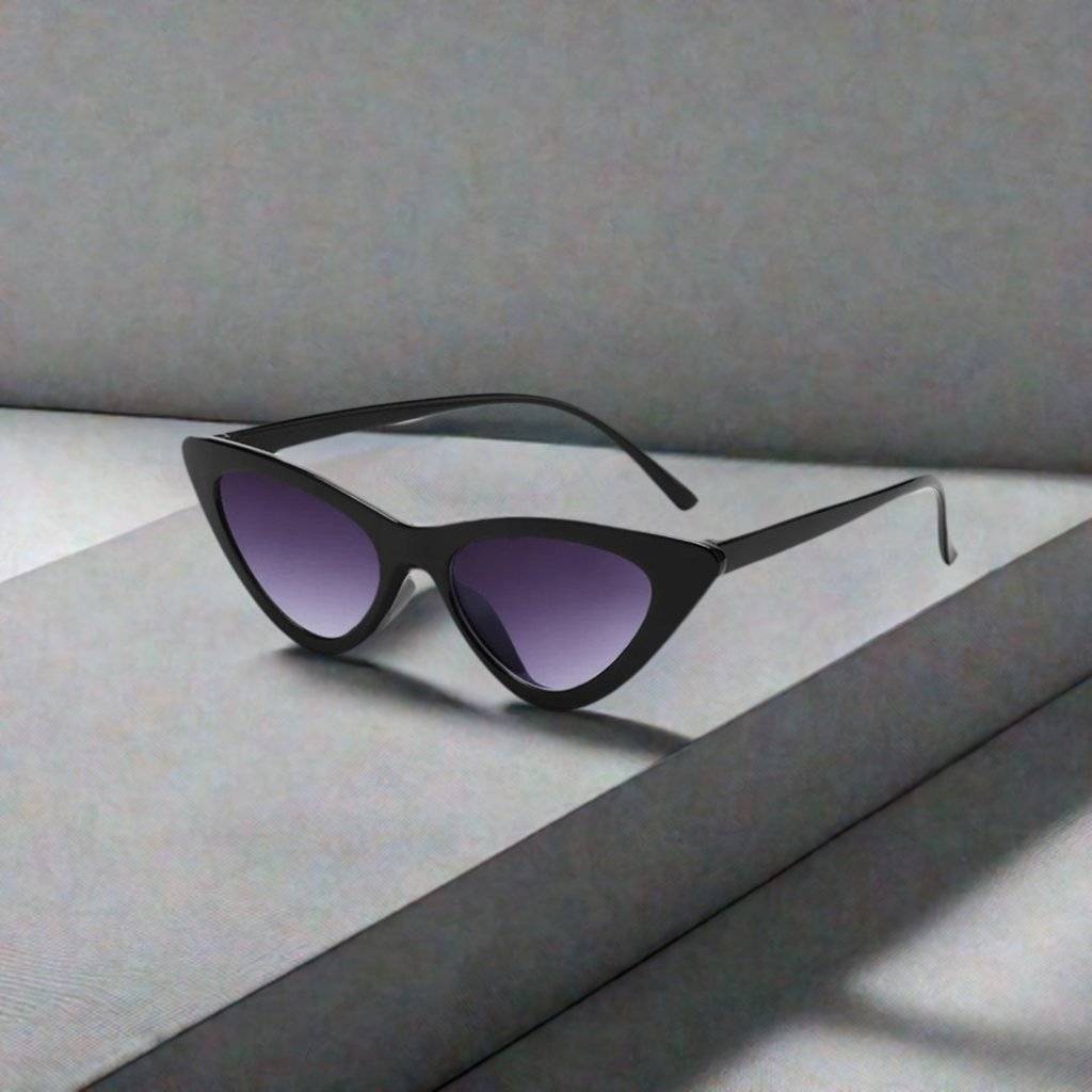 a pair of sunglasses sitting on top of a box