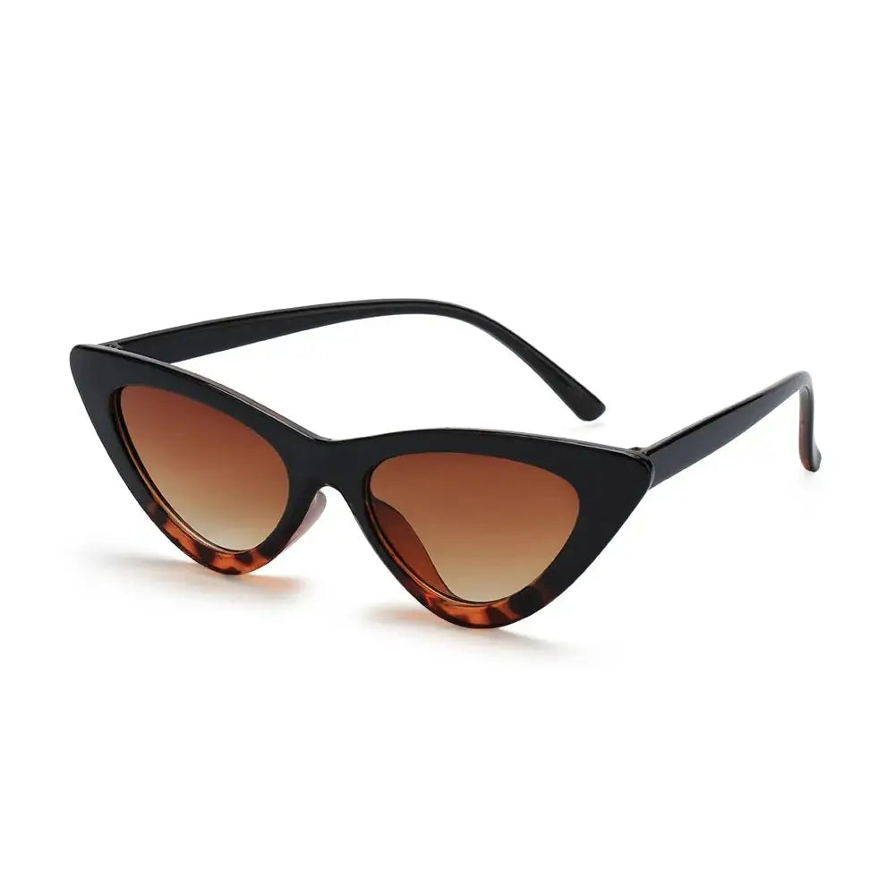 a pair of cat eye sunglasses on a white background