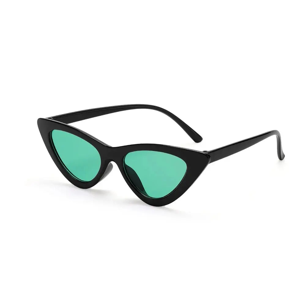 a pair of black sunglasses with green tinted lenses