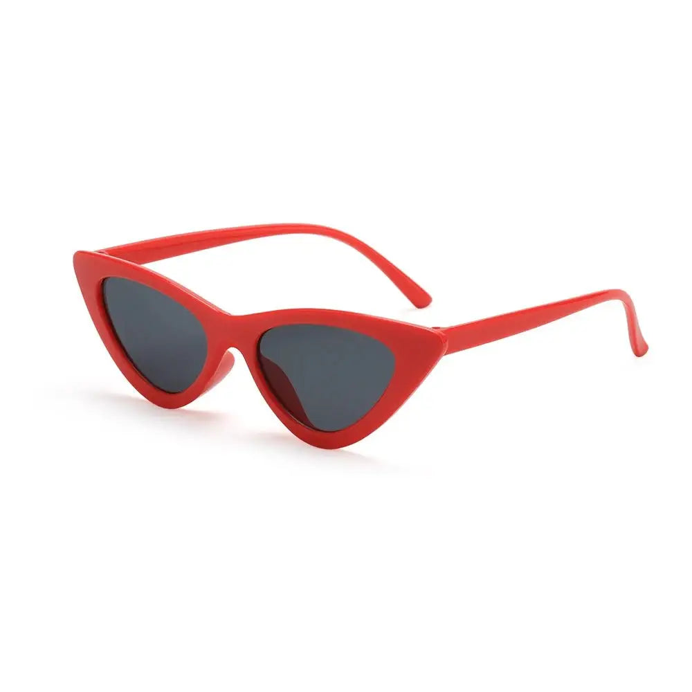 a pair of red sunglasses on a white background