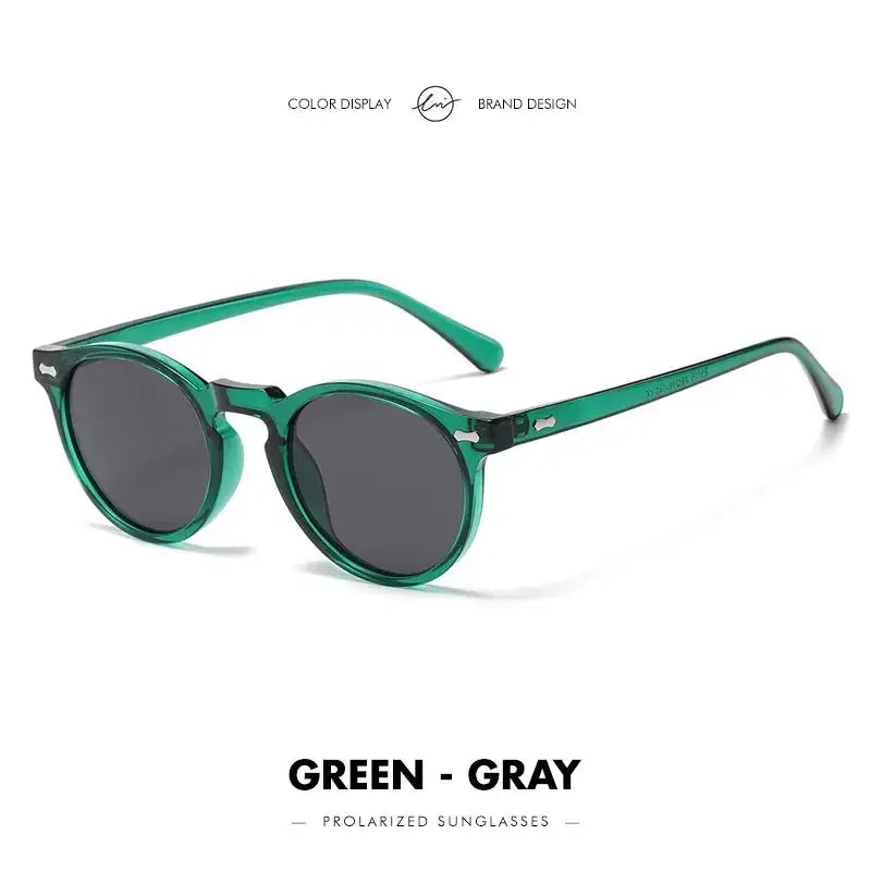 a pair of sunglasses with a green frame