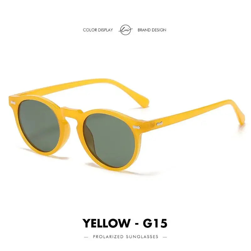 a pair of yellow sunglasses on a white background