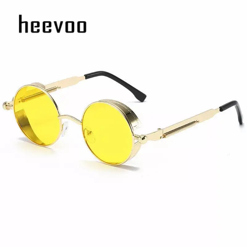 a pair of yellow sunglasses with a black handle