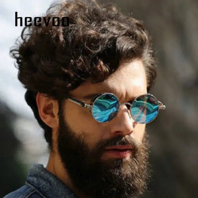 a man with a beard wearing sunglasses