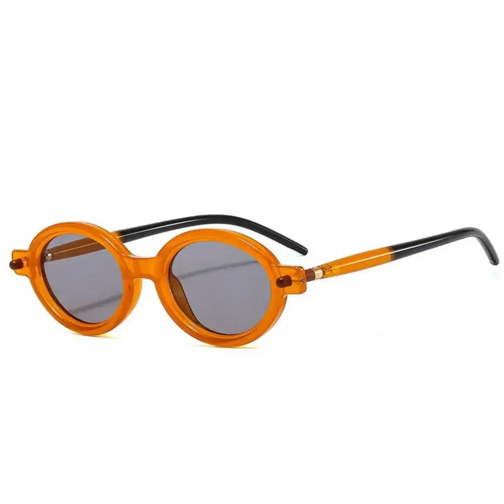 a pair of orange sunglasses on a white background