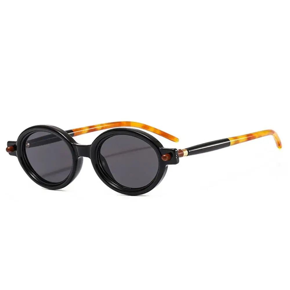 a pair of black sunglasses with tortoiseshell frames