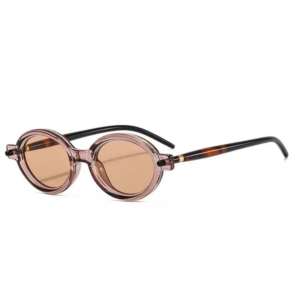 a pair of round sunglasses with a tortoise frame