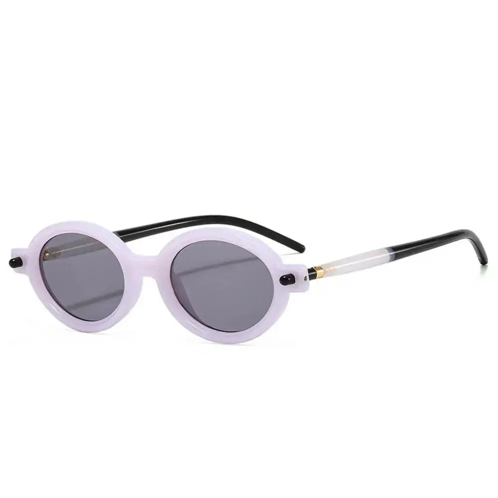 a pair of white sunglasses with a black handle