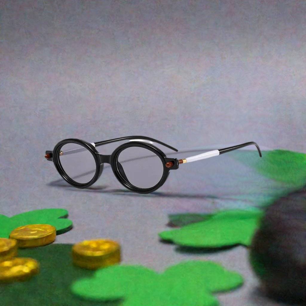 a pair of glasses sitting on top of a table