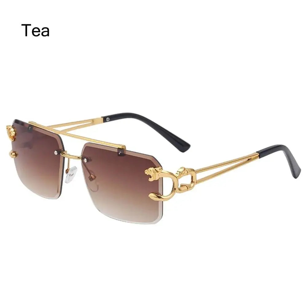 a pair of sunglasses with a gold frame and brown lens