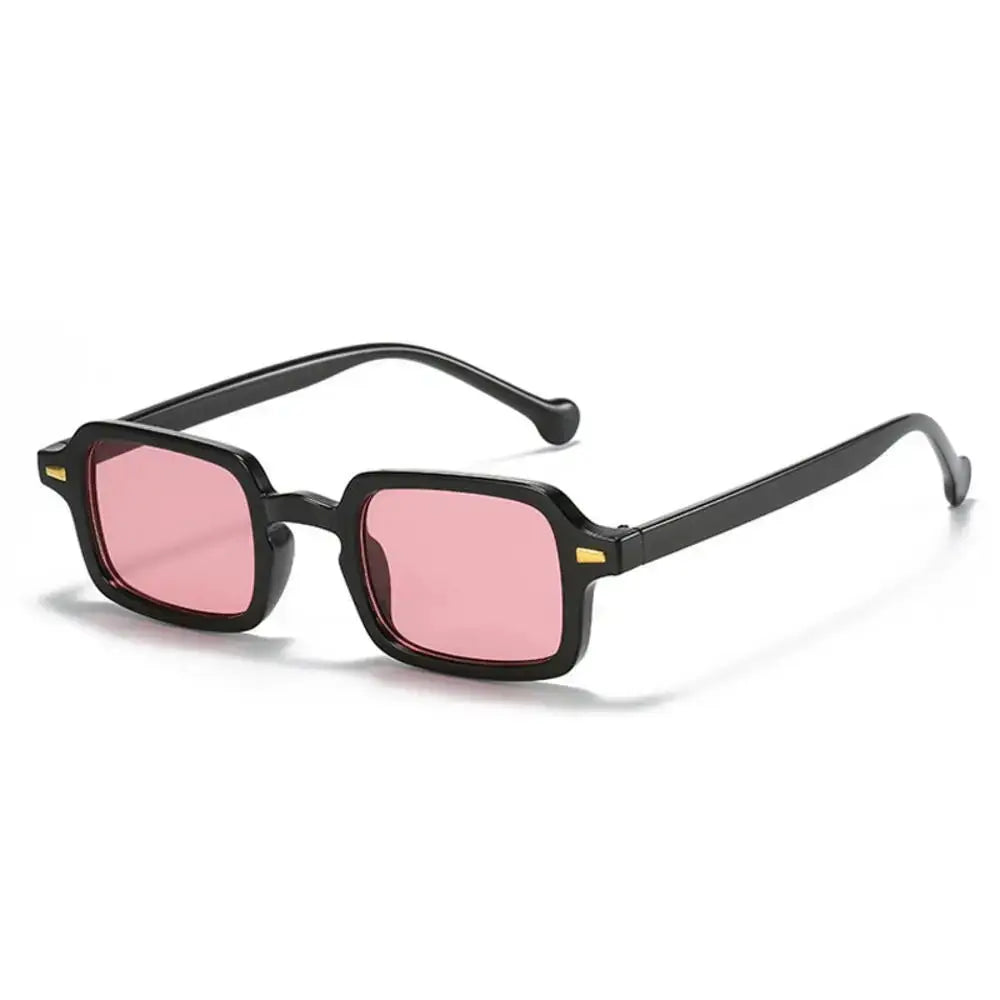 a pair of black sunglasses with pink lenses