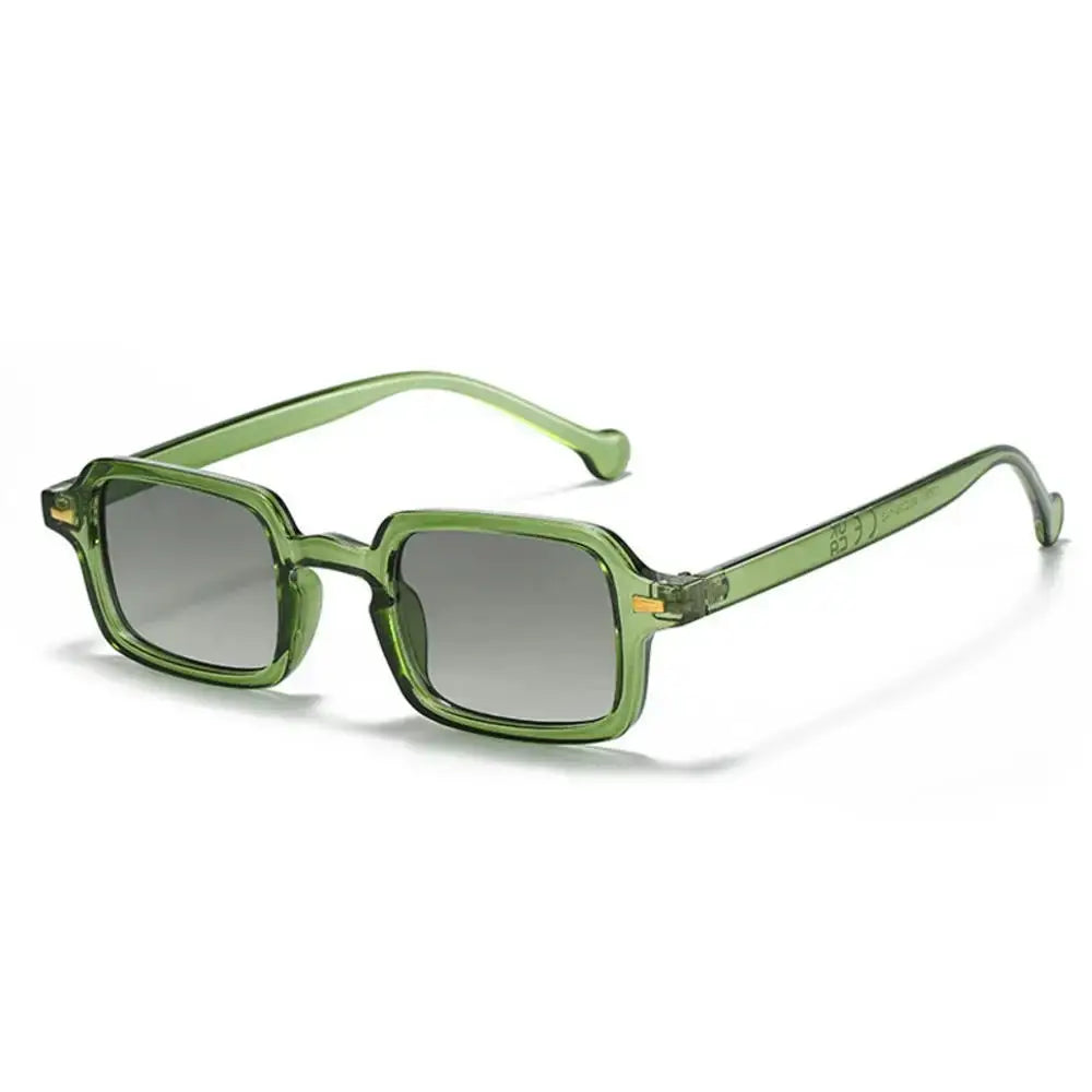 a pair of green sunglasses on a white background