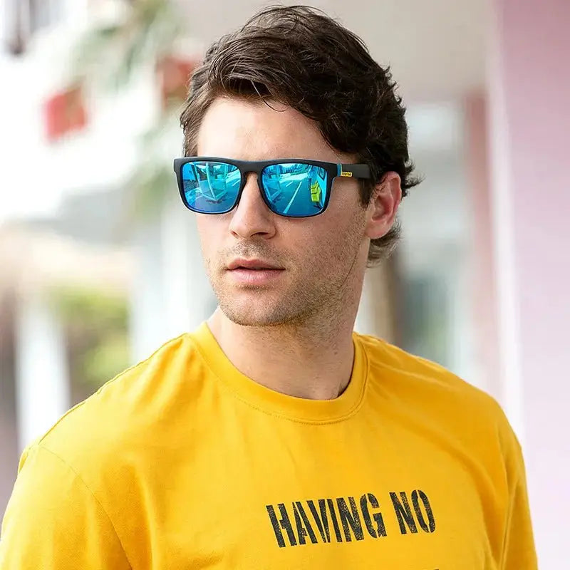 a man wearing a yellow shirt and blue sunglasses
