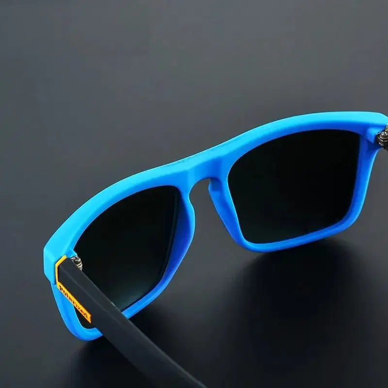 a pair of blue sunglasses sitting on top of a table