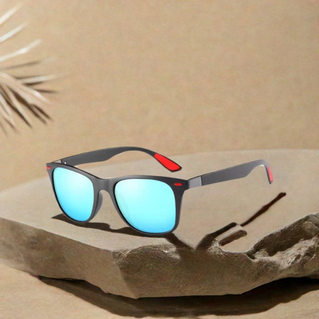 a pair of sunglasses sitting on top of a rock